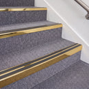Mirrorflect Gold double insert chevron stair nosing, 70mm riser with Dark Grey inserts, fitted on carpeted stairs