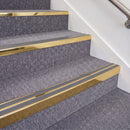 Mirrorflect Gold double insert chevron stair nosing, 70mm riser with Mid Grey inserts, fitted on carpeted stairs