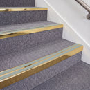 Mirrorflect Gold double insert chevron stair nosing, 70mm riser with Sage Green inserts, fitted on carpeted stairs