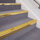 Mirrorflect Gold double insert chevron stair nosing, 70mm riser with Yellow inserts, fitted on carpeted stairs