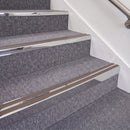 Mirrorflect Silver double insert chevron stair nosing, 70mm riser with Brown inserts, fitted on carpeted stairs