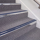 Mirrorflect Silver double insert chevron stair nosing, 70mm riser with Dark Blue inserts, fitted on carpeted stairs