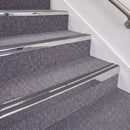 Mirrorflect Silver double insert chevron stair nosing, 70mm riser with Dark Grey inserts, fitted on carpeted stairs