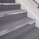 Mirrorflect Silver double insert chevron stair nosing, 70mm riser with Mid Grey inserts, fitted on carpeted stairs
