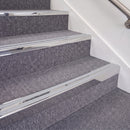 Mirrorflect Silver double insert chevron stair nosing, 70mm riser with Polar Grey inserts, fitted on carpeted stairs
