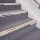 Mirrorflect Silver double insert chevron stair nosing, 70mm riser with Sahara inserts, fitted on carpeted stairs