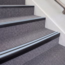 Satin Black double insert chevron stair nosing, 70mm riser with Aura inserts, fitted on carpeted stairs