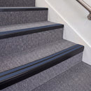 Satin Black double insert chevron stair nosing, 70mm riser with Blue inserts, fitted on carpeted stairs
