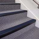 Satin Black double insert chevron stair nosing, 70mm riser with Dark Blue inserts, fitted on carpeted stairs