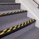 Satin Black double insert chevron stair nosing, 70mm riser with Hazard black and yellow inserts, fitted on carpeted stairs