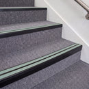 Satin Black double insert chevron stair nosing, 70mm riser with Sage Green inserts, fitted on carpeted stairs