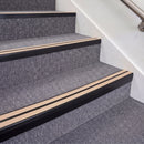 Satin Black double insert chevron stair nosing, 70mm riser with Sahara inserts, fitted on carpeted stairs