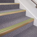 Satin Bronze double insert chevron stair nosing, 70mm riser with Apple Green inserts, fitted on carpeted stairs