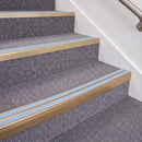 Satin Bronze double insert chevron stair nosing, 70mm riser with Aura inserts, fitted on carpeted stairs