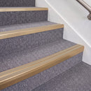 Satin Bronze double insert chevron stair nosing, 70mm riser with Beige inserts, fitted on carpeted stairs