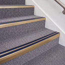 Satin Bronze double insert chevron stair nosing, 70mm riser with Dark Blue inserts, fitted on carpeted stairs