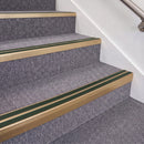 Satin Bronze double insert chevron stair nosing, 70mm riser with Dark Green inserts, fitted on carpeted stairs