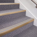 Satin Bronze double insert chevron stair nosing, 70mm riser with Polar Grey inserts, fitted on carpeted stairs
