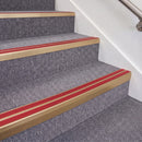 Satin Bronze double insert chevron stair nosing, 70mm riser with Red inserts, fitted on carpeted stairs