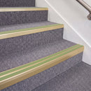 Satin Gold double insert chevron stair nosing, 70mm riser with Apple Green inserts, fitted on carpeted stairs