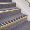 Satin Gold double insert chevron stair nosing, 70mm riser with Blue inserts, fitted on carpeted stairs