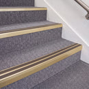 Satin Gold double insert chevron stair nosing, 70mm riser with Brown inserts, fitted on carpeted stairs