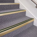 Satin Gold double insert chevron stair nosing, 70mm riser with Dark Green inserts, fitted on carpeted stairs