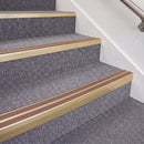 Satin Gold double insert chevron stair nosing, 70mm riser with Mid Brown inserts, fitted on carpeted stairs