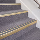 Satin Gold double insert chevron stair nosing, 70mm riser with Mid Grey inserts, fitted on carpeted stairs