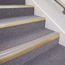 Satin Gold double insert chevron stair nosing, 70mm riser with Polar Grey inserts, fitted on carpeted stairs