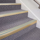 Satin Gold double insert chevron stair nosing, 70mm riser with Sage Green inserts, fitted on carpeted stairs