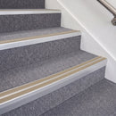 Satin Silver double insert chevron stair nosing, 70mm riser with Beige inserts, fitted on carpeted stairs