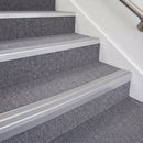Satin Silver double insert chevron stair nosing, 70mm riser with Polar Grey inserts, fitted on carpeted stairs