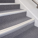 Satin Silver double insert chevron stair nosing, 70mm riser with White inserts, fitted on carpeted stairs