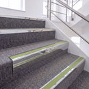 Bright Polished single insert chevron stair nosing, 65mm riser with Apple Green insert, fitted on carpeted stairs