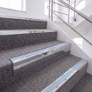 Bright Polished single insert chevron stair nosing, 65mm riser with Aura insert, fitted on carpeted stairs
