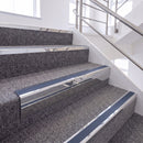 Bright Polished single insert chevron stair nosing, 65mm riser with Blue insert, fitted on carpeted stairs
