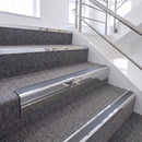 Bright Polished single insert chevron stair nosing, 65mm riser with Dark Grey insert, fitted on carpeted stairs