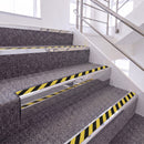 Bright Polished single insert chevron stair nosing, 65mm riser with Hazard black and yellow insert, fitted on carpeted stairs