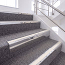 Bright Polished single insert chevron stair nosing, 65mm riser with White insert, fitted on carpeted stairs