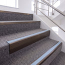 Dark Bronze single insert chevron stair nosing, 65mm riser with Aura insert, fitted on carpeted stairs