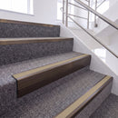 Dark Bronze single insert chevron stair nosing, 65mm riser with Beige insert, fitted on carpeted stairs