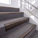 Dark Bronze single insert chevron stair nosing, 65mm riser with Brown insert, fitted on carpeted stairs