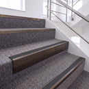 Dark Bronze single insert chevron stair nosing, 65mm riser with Dark Grey insert, fitted on carpeted stairs