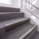 Dark Bronze single insert chevron stair nosing, 65mm riser with Oyster insert, fitted on carpeted stairs