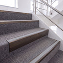 Dark Bronze single insert chevron stair nosing, 65mm riser with Polar Grey insert, fitted on carpeted stairs