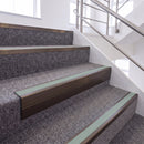 Dark Bronze single insert chevron stair nosing, 65mm riser with Sage Green insert, fitted on carpeted stairs