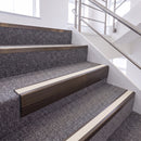 Dark Bronze single insert chevron stair nosing, 65mm riser with White insert, fitted on carpeted stairs