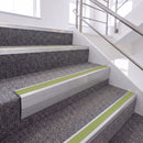 Mill Finish single insert chevron stair nosing, 65mm riser with Apple Green insert, fitted on carpeted stairs