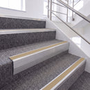 Mill Finish single insert chevron stair nosing, 65mm riser with Beige insert, fitted on carpeted stairs